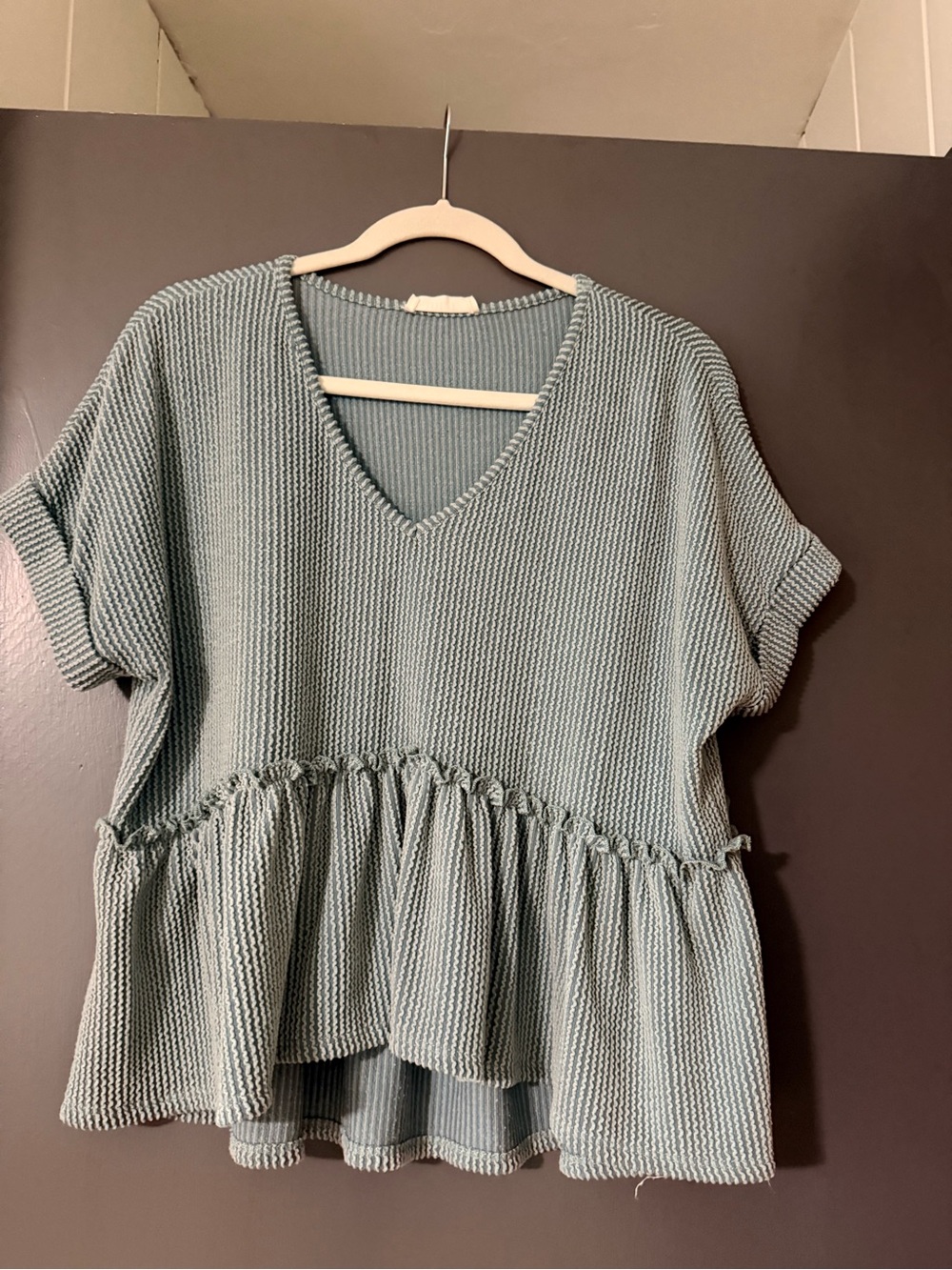 Jolie Sage Green V‑Neck Peplum Knit Top